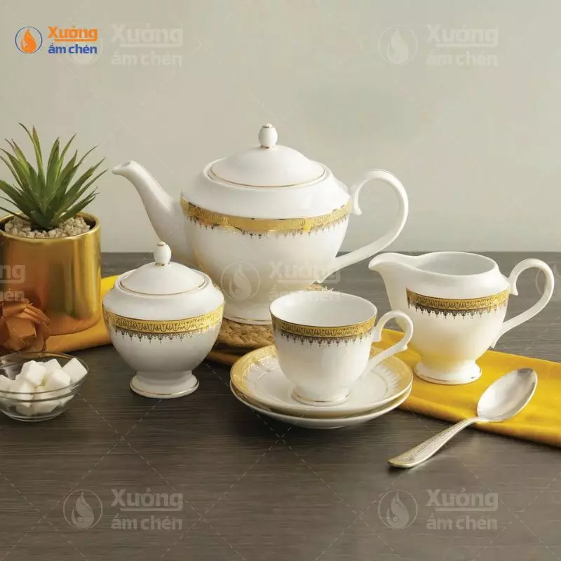 Bộ ấm chén uống trà dát vàng men trắng